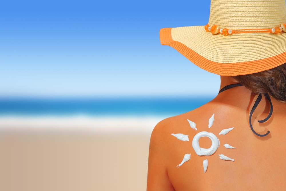 https://www.bellanaija.com/wp-content/uploads/2016/10/dreamstime_woman-with-sunscreen-beach.jpg