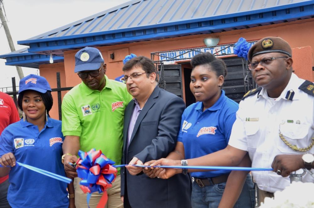 Sole Administrator, Apapa Iganmu Lcda, Mr Olumide Olayomi Commissioning The Rehabilitated Public Toilet By Harpic In Apapa Lagos