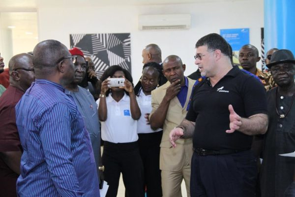 Carlos Wanderley, Head, Retail Banking, Union Bank, giving guests a tour of the new branch in Garden Avenue, Enugu