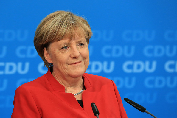 Angela Merkel, Germany's chancellor and Christian Democratic Union (CDU) party leader, smiles while speaking during a news conference at the party's headquarters in Berlin, Germany, on Sunday, Nov. 20, 2016. Merkel told senior members of her Christian Democratic Union that she'll run again as party leader and seek a fourth term as German chancellor, ending months of speculation over her political future. Photographer: Krisztian Bocsi/Bloomberg via Getty Images