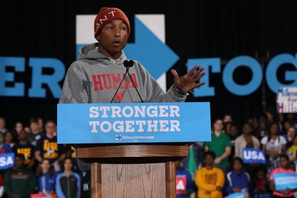RALEIGH, NC - NOVEMBER 03: Recording artist Pharrell Williams speaks during a campaign rally with Democratic presidential nominee Hillary Clinton at Coastal Credit Union Music Park at Walnut Creek on November 3, 2016 in Raleigh, North Carolina. With less than a week before election day, Hillary Clinton is campaigning in North Carolina. (Photo by Justin Sullivan/Getty Images)