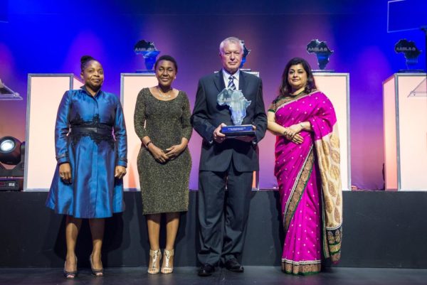 Pieter Fourie receiving the award on behalf of Aliko Dangote