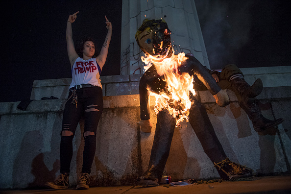 UNITED STATES - NOVEMBER 09: Protesters burn an effigy of Donald Trump in Lee Circle before a march through New Orleans, La., November 9, 2016. (Photo By Tom Williams/CQ Roll Call)