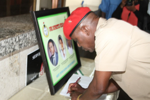 Solomon Dalung signing the Condolence Register for the deceased Corps Members at the NYSC HQ in Abuja