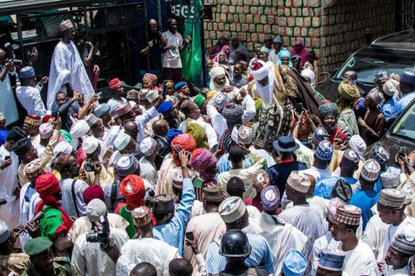 The Dan Amana mounting a horse after being turbaned at palace of Emir of Dutse.