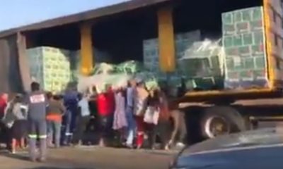 Watch #Trending video of people looting Beer Truck on the Road - BellaNaija