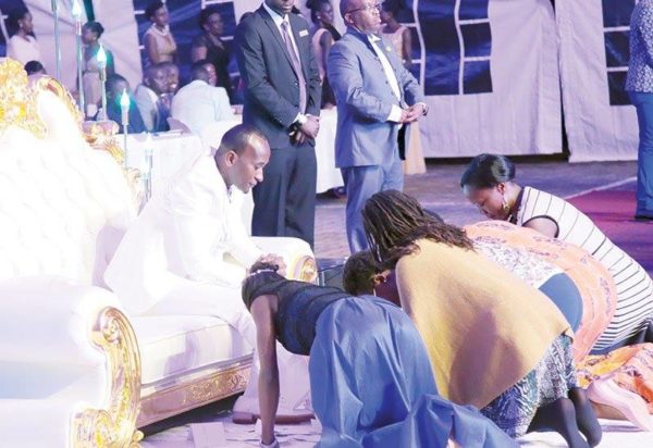 See Reactions to #Trending Photos of Congregants kissing Prophet's Feet - BellaNaija