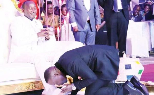 See Reactions to #Trending Photos of Congregants kissing Prophet's Feet - BellaNaija