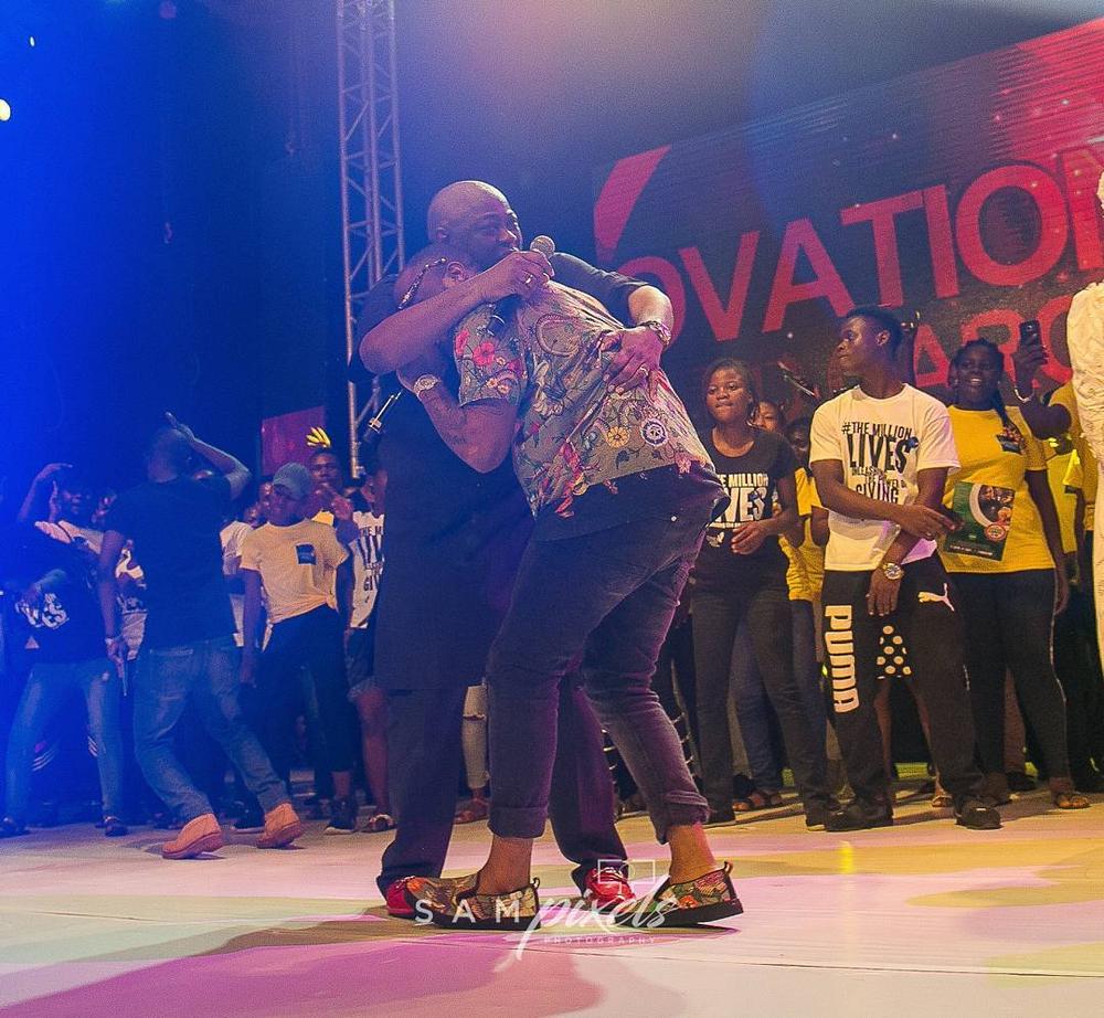 Season to Remember! Davido & Dele Momodu reconcile at Ovation Red Carol 2017