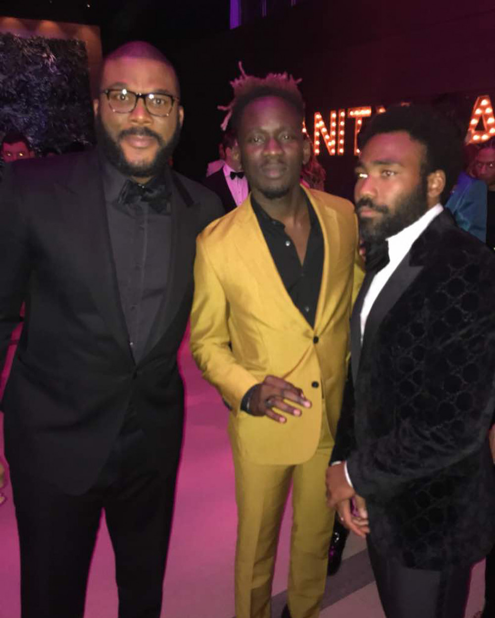 Detty Boy to the World! Mr Eazi joins Diddy, Chadwick Boseman, Lupita Nyong'o at Vanity Fair/Apple Music #Oscars Dinner