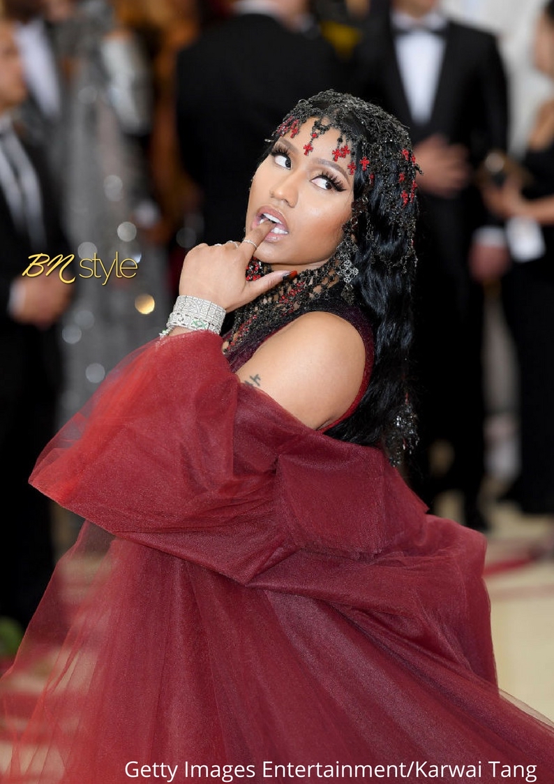 Nicki Minaj models fiery red hair and showcases curves in Burberry