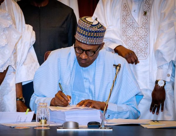 President Buhari signs 2018 Budget | BellaNaija