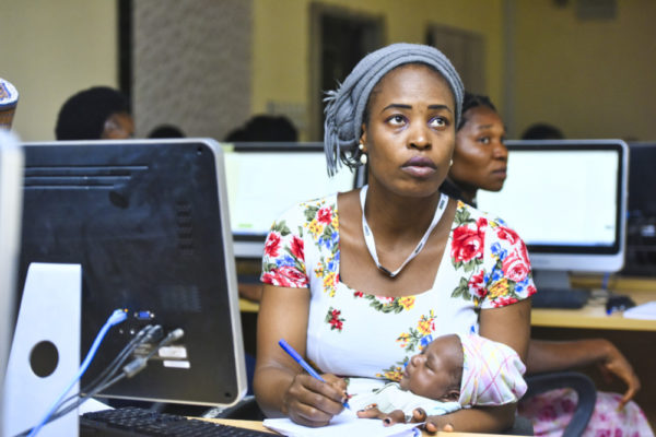 Woman with a baby at Tech event