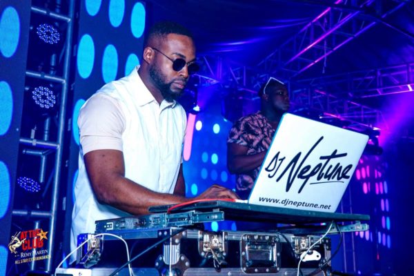 DJ Neptune playing at the club with Remy Martins