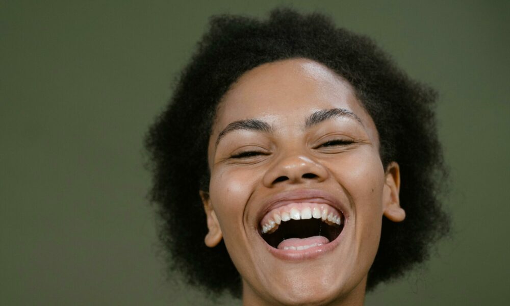 A thoughtful young individual gazing into the distance