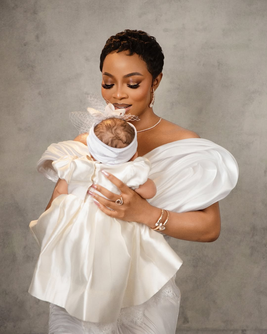 Too Cute! Toke Makinwa & Daughter Yakira Match in White for Dedication