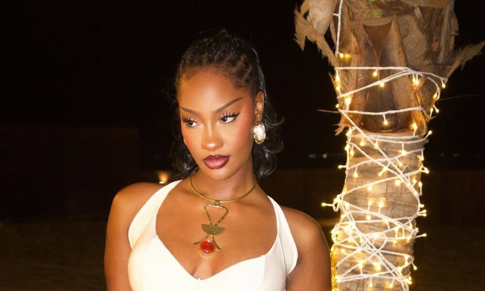 Tems' Stunning White Bodycon Dress Steals the Show in Dave's 'Raindance' Video!