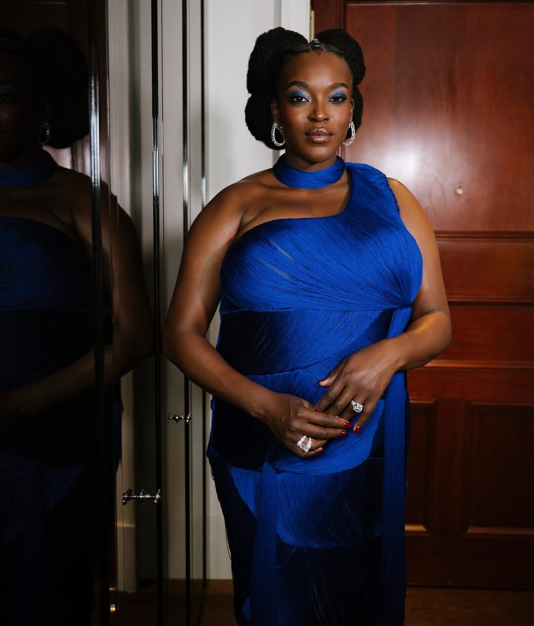 Royal Blue Fringe, Bold Teal Eyes & a Baby on the Way: Inside Wunmi Mosaku’s 2026 BAFTA Look