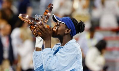 Victoria Mboko holding the National Bank Open trophy at IGA Stadium in Montreal after defeating Naomi Osaka in the 2025 final.