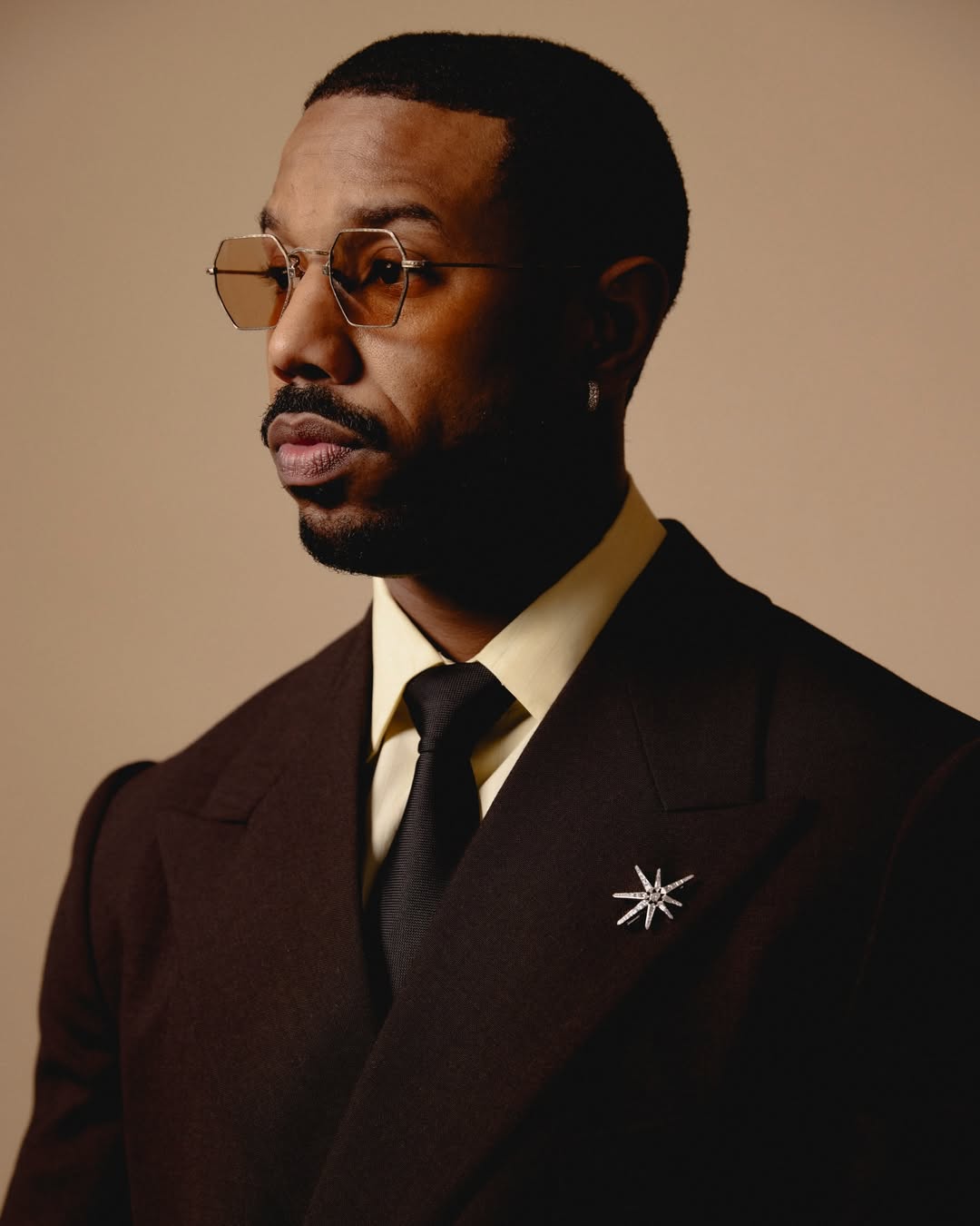 A portrait of Michael B. Jordan, who won the 2026 Best Actor Oscar for his dual role as twins Smoke and Stack in the film Sinners.