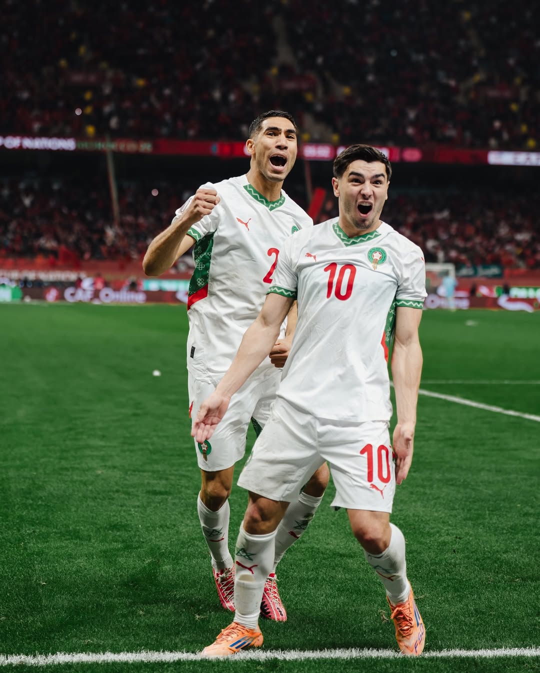 Morocco’s Brahim Díaz and Achraf Hakimi celebrating a goal during the 2025 Africa Cup of Nations quarter-final against Cameroon in Rabat.