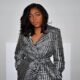 Hanifa founder Anifa Mvuemba in a silver houndstooth wrap coat