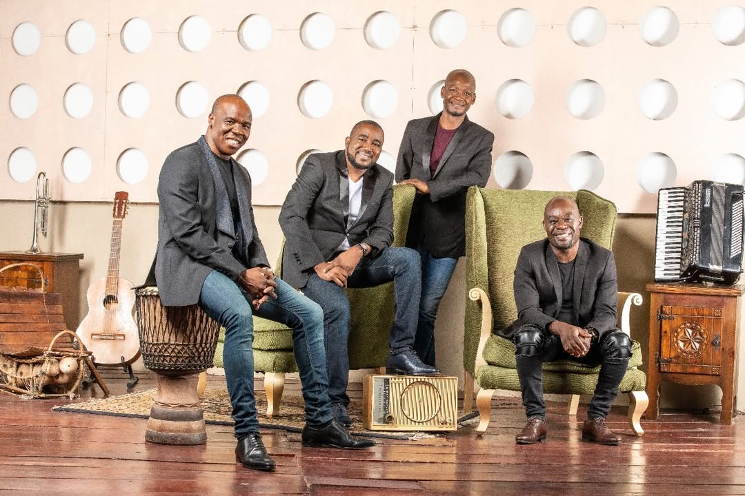 Ivorian music group Magic System (A'salfo, Goudé, Tino, and Manadja) posing together.