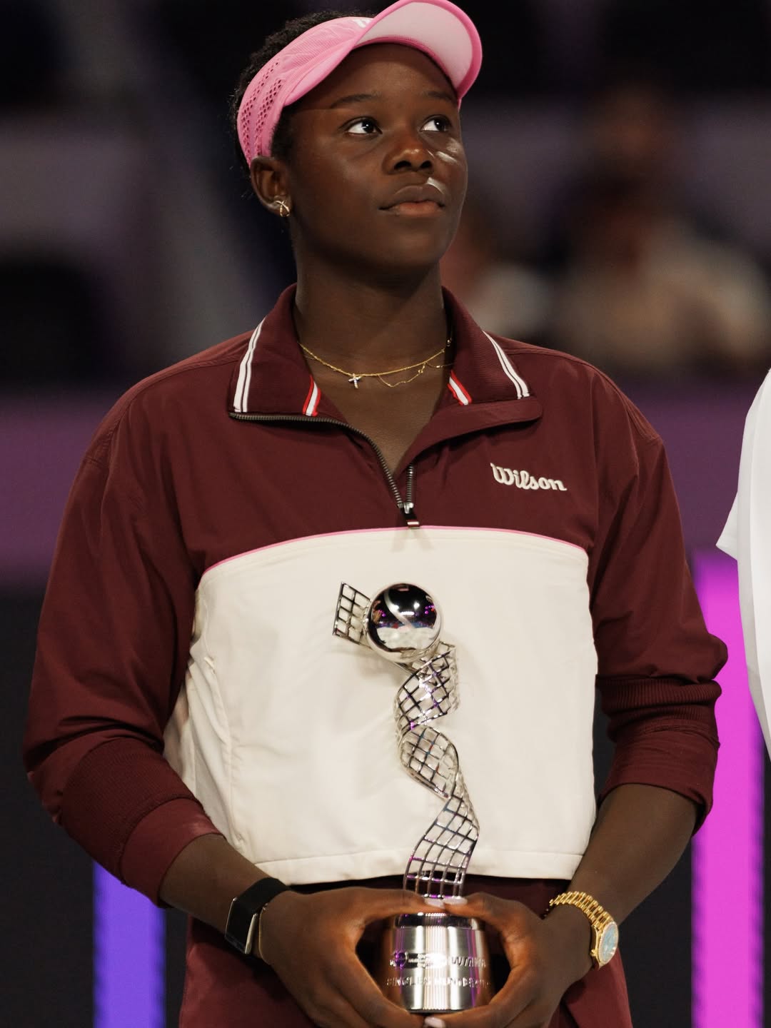 Victoria Mboko holding the runner-up trophy at the Khalifa International Tennis Complex in Doha after her historic Top 10 breakthrough in February 2026.
