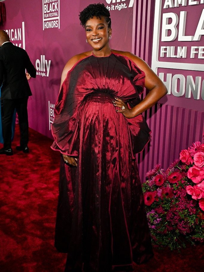 Actress Wunmi Mosaku wearing a custom red satin draped gown by Nigerian designer Sisiano Paolo at the 2026 American Black Film Festival Honours.