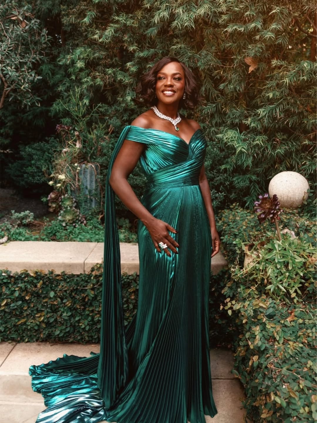 Viola Davis in a custom pleated Gucci peacock green silk Lurex gown with Pasquale Bruni diamond and emerald jewelry at the 32nd Actors Awards.
