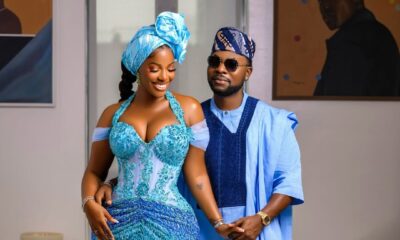 Hilda Baci and Damilola Akinwunmi posing together in coordinated blue traditional outfits at the Simi Sanya and Femi Dapson's traditional wedding.