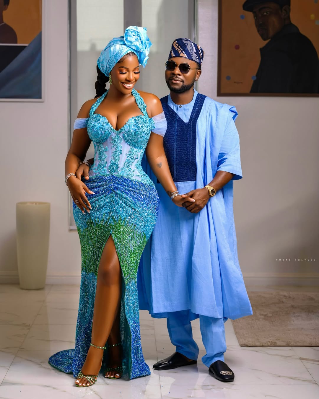 Hilda Baci and Damilola Akinwunmi posing together in coordinated blue traditional outfits at the Simi Sanya and Femi Dapson's traditional wedding.