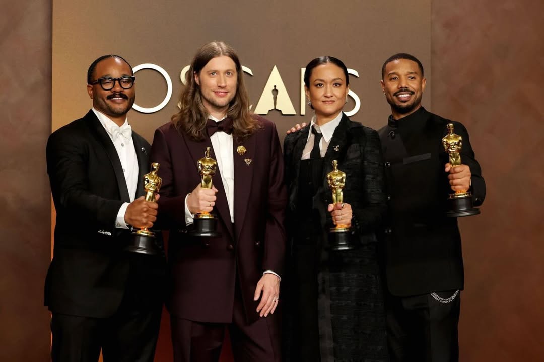 Ryan Coogler, Ludwig Göransson, Autumn Durald Arkapaw, and Michael B. Jordan posing together with their Academy Awards at the 98th Oscars.