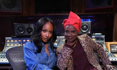 Angélique Kidjo and Ayra Starr sitting in a recording studio for their Aye Kan collaboration.