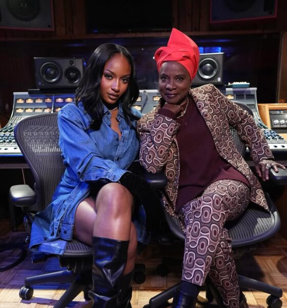 Angélique Kidjo and Ayra Starr sitting in a recording studio for their Aye Kan collaboration.