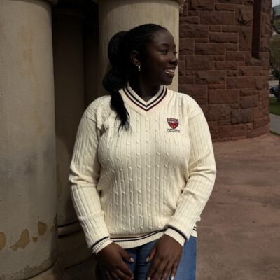 Ifeanyi Ruth Umunna posing inside the historic Memorial Hall at Harvard University during her transition to legal studies.