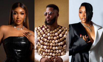 Idia Aisien in a black croc-skin strapless dress, Akin Faminu in a cowrie shell embellished vest, and Stephanie Coker in a monochrome coat dress at the premiere.