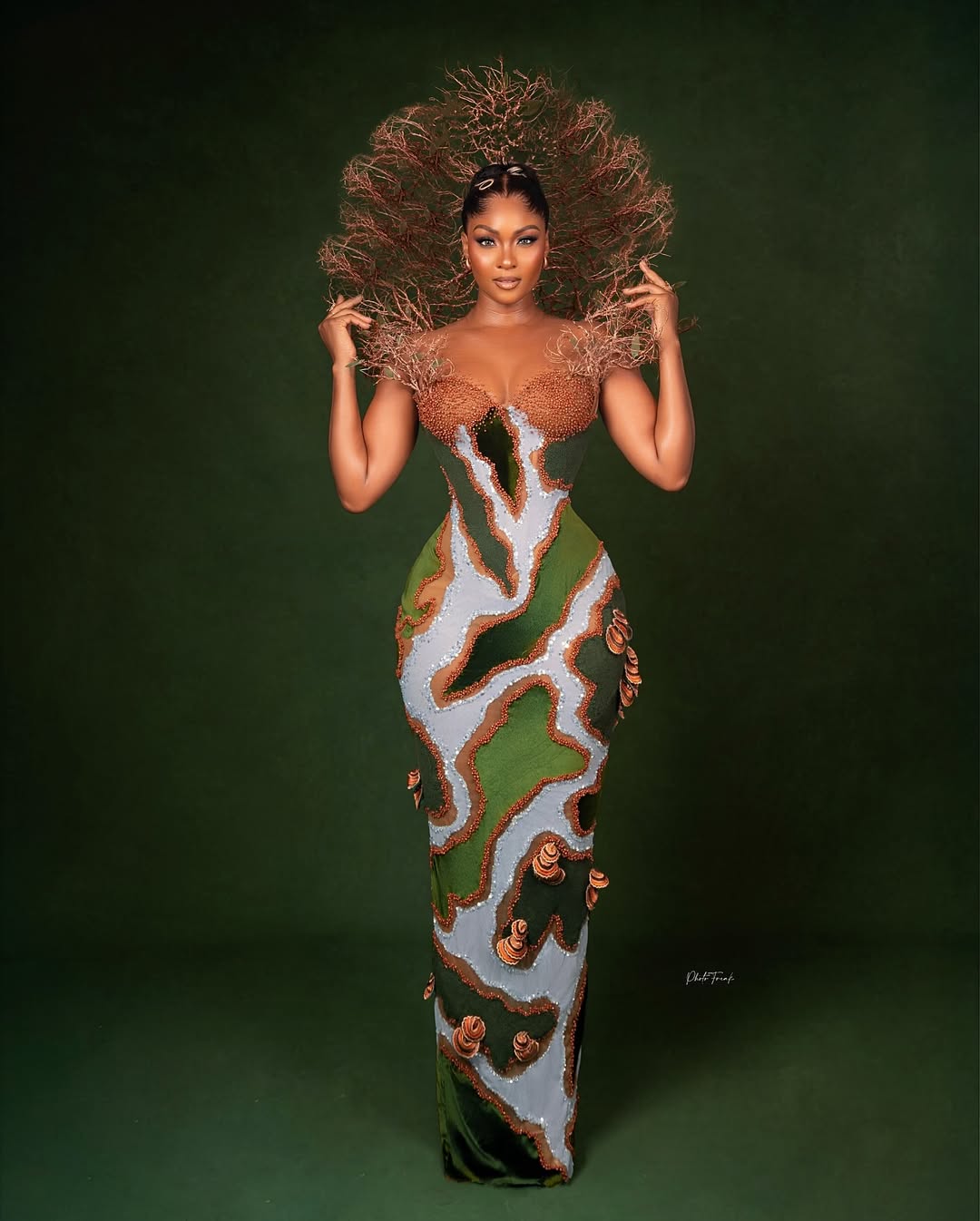 Osas Ighodaro at the 2025 AMVCA in a Mother Earth inspired Veekee James gown with twig-like head crown and mushroom embellishments.