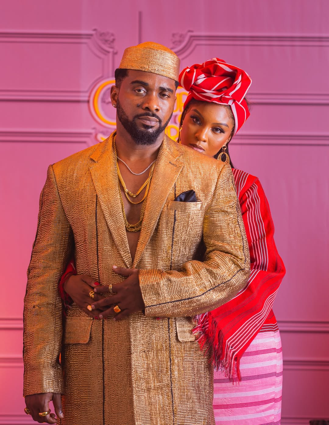 Uzor Arukwe and Osas Ighodaro in traditional gold and red attire for the film Colours of Fire.