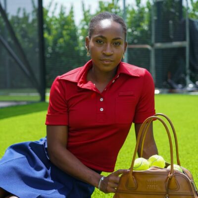 Portrait of Coco Gauff featuring her 4a-c natural hair and dewy makeup for the Miu Miu Spring/Summer 2026 ad.