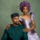 Nollywood actor Jide Kene Achufusi in a forest green Agbada and black beaded cap seated beside his bride, Ifeoma, who is wearing a lilac structured corset top and floral lace mermaid skirt for their pre-wedding photoshoot.