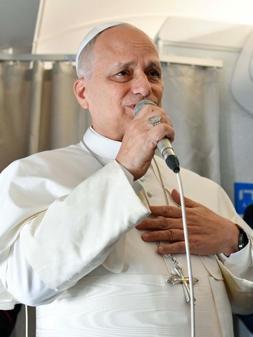 Pope Leo XIV speaking to a group of journalists on board the papal flight to Algiers at the start of his 10-day African journey.