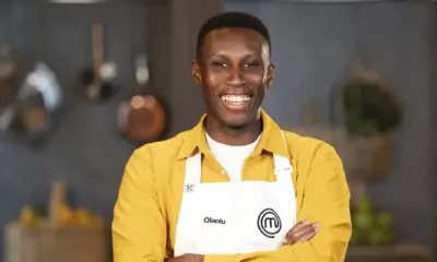 Olaolu Olorunnimbe wearing the official MasterChef Australia 2026 white apron after securing his place in the Top 24 competition.