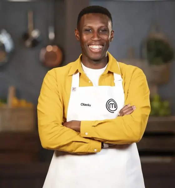Olaolu Olorunnimbe wearing the official MasterChef Australia 2026 white apron after securing his place in the Top 24 competition.