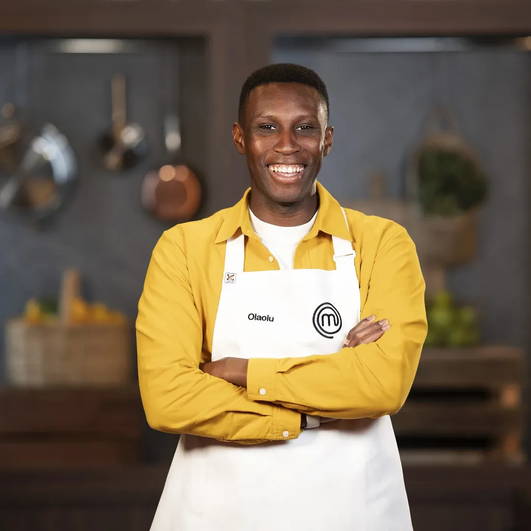 Olaolu Olorunnimbe wearing the official MasterChef Australia 2026 white apron after securing his place in the Top 24 competition.