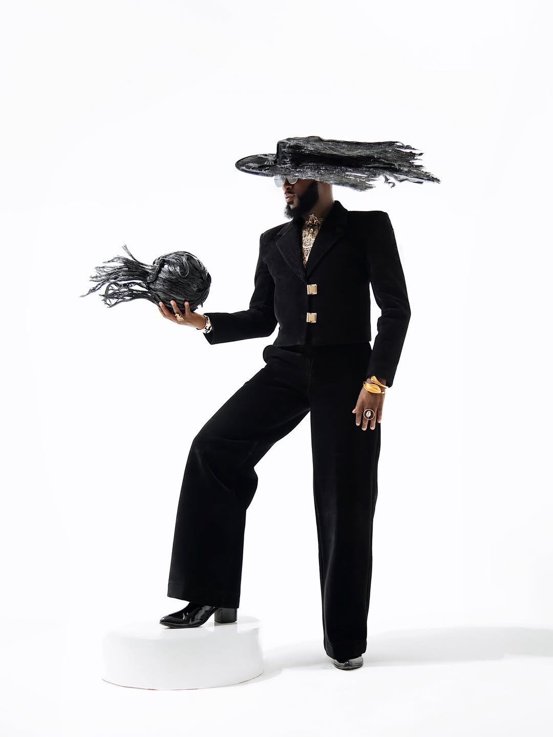 Akin Faminu in a custom Weizdhurm Franklyn black velvet ensemble for the 2026 Met Gala "Fashion Is Art" theme, photographed by Chuchu Ojekwe.