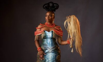 Bisola Aiyeola at the AMVCA 12 Cultural Night wearing an Igbo-inspired "Mmiri Ndu" waterfall gown and holding a traditional horsetail.