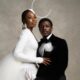 Call of My Life lead actors Uzoamaka Aniunoh in an avant-garde white lace blazer dress with a sculptural headpiece and Andrew Bunting in a black velvet tuxedo posing together at the 12th Africa Magic Viewers' Choice Awards (AMVCA).