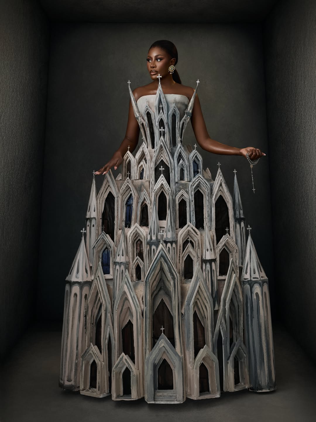 Nana Akua Addo in a grey architectural cathedral-inspired gown by Mohammed Abbas Ossu, made in Lagos for the 2026 AMVCA.