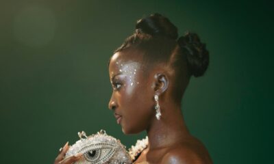 Close-up of Genoveva Umeh’s crystal eye clutch and face jewels at the 12th AMVCA.